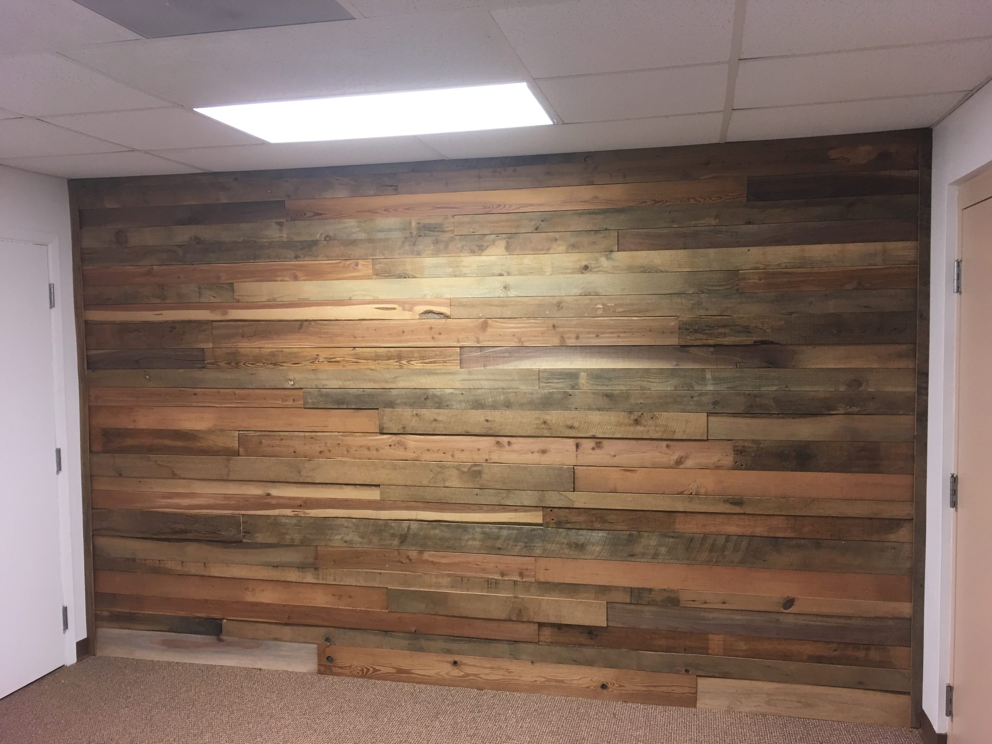 Reclaimed-style wood plank accent wall
